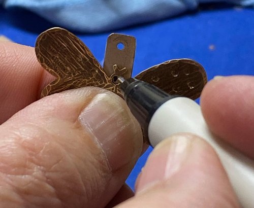 Susan LeGuyader's Butterfly Earrings - , Contemporary Wire Jewelry, Dapping, Dapping Jewelry, How To Punch Holes, Hole Punching, Punch A Hole, Texturing, Butane Torch, Soldering, Solder, punch the titanium strip.    